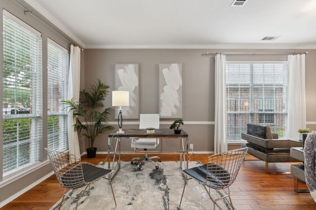 Office area with wood finished floors, ornamental molding, and baseboards | Image 10