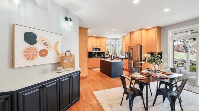 Enjoy a cozy kitchen nook perfect for your morning coffee just steps from the spacious dining area, which offers plenty of room for a large dining table close to the kitchen | Image 19