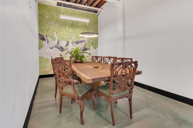 Dining room with concrete floors | Image 9