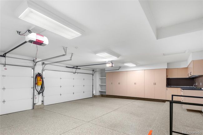 3-car garage with epoxy floors and storage | Image 33