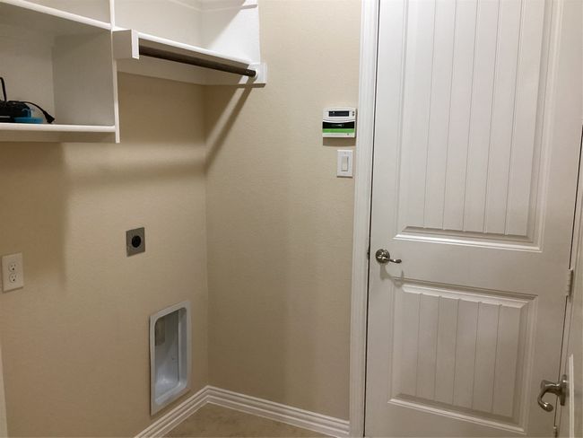 Laundry room featuring hookup for an electric dryer and baseboards | Image 19