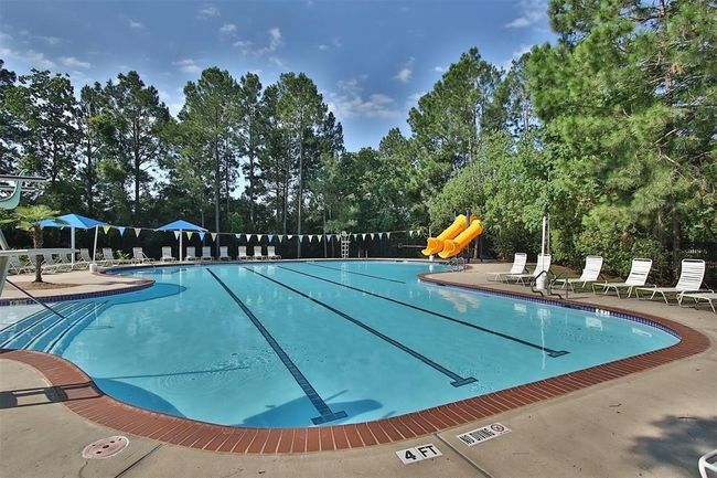 Dive into summer fun at Windrose’s community pool with exciting slides! Perfect for weekend relaxation, swim meets, and making the most of sunny days in this popular community. Enjoy a splash-filled experience right at your doorstep! | Image 50