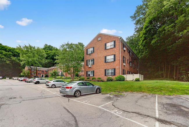 View of property featuring uncovered parking | Image 25