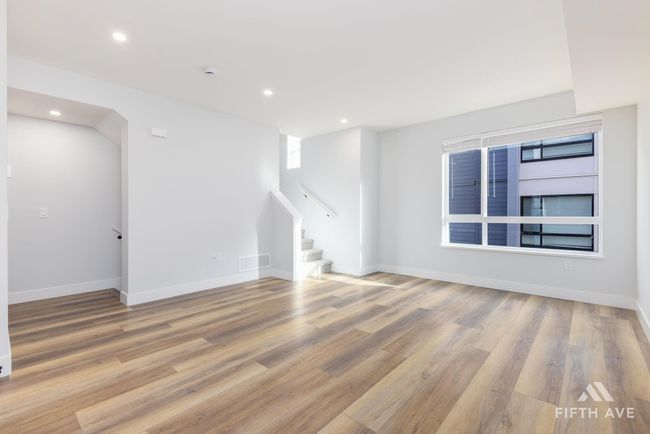 Empty room featuring stairs, light wood-style flooring, and recessed lighting | Image 7