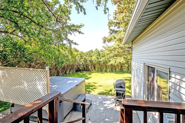 deck off of kitchen and back yard hot tub and BBQ area | Image 25
