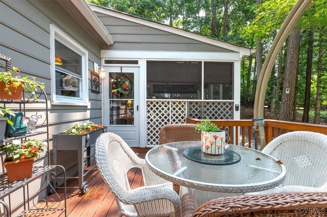 Deck featuring outdoor dining area and a sunroom | Image 45