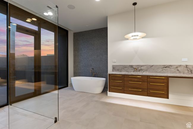Full bath with vanity, a soaking tub, and tile patterned flooring | Image 37