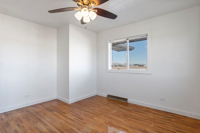 Cozy bedroom with large windows for natural light. | Image 44