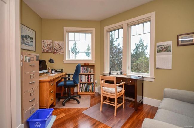 Office space with dark hardwood floors and wealth of natural light | Image 22
