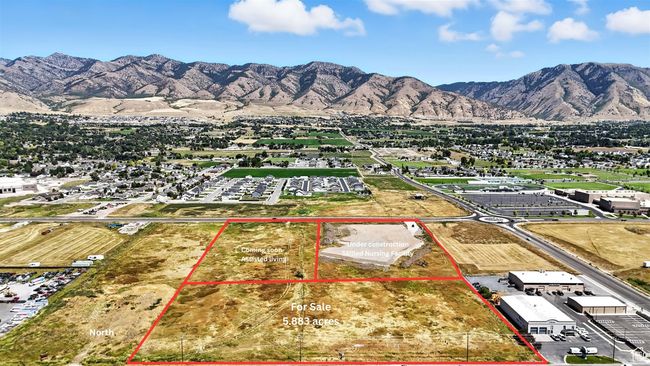 Aerial overview of property's location with a mountainous background and property parcel outlined | Image 14