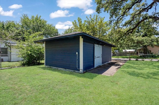 one car garage being used for storage. | Image 29