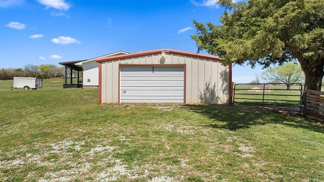Detached garage with driveway and fence | Image 5
