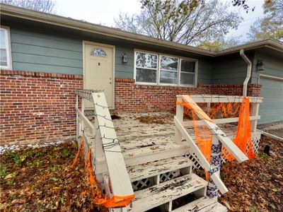 View of exterior entry with a garage | Image 2