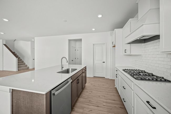An expansive gourmet kitchen with an island waiting for you to cook and entertain! | Image 4
