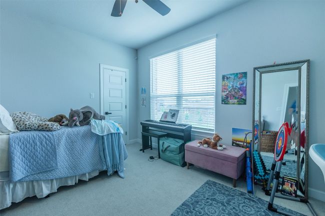 Bedroom featuring carpet flooring and ceiling fan | Image 26