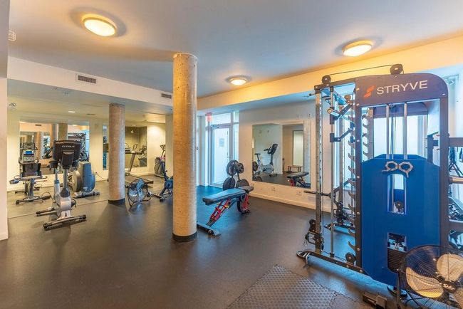 Workout area featuring a healthy amount of sunlight and visible vents | Image 34
