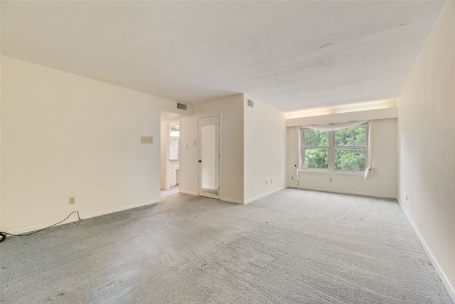 Unfurnished room featuring light colored carpet and baseboards | Image 27