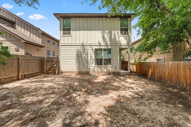 Rear view of house with a fenced backyard | Image 21