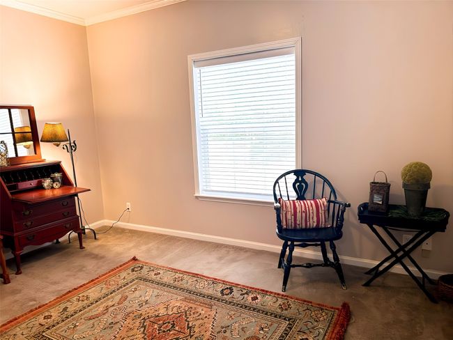 Sitting room featuring baseboards, crown molding, and carpet | Image 20