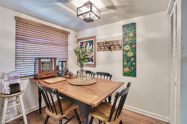 Dining room featuring wood finished floors | Image 18