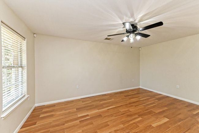 Empty room featuring light wood finished floors and baseboards | Image 7