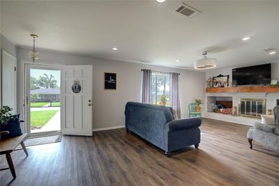 Living room with dark hardwood / wood-style flooring and a healthy amount of sunlight | Image 2