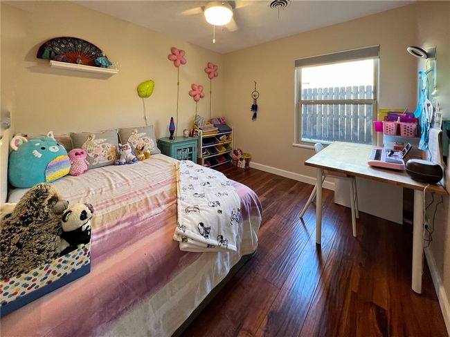 BEDROOM 2 IN MIDDLE OF HOUSE. WOOD FLOORS. GOOD SIZE | Image 12
