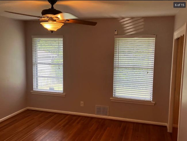 Empty room with ceiling fan and wood finished floors | Image 5