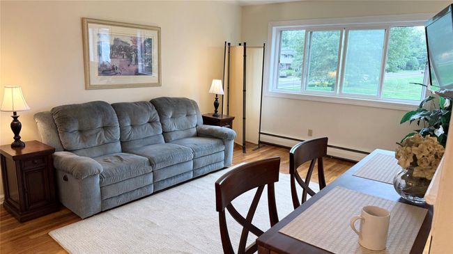 Living room with wood finished floors | Image 5