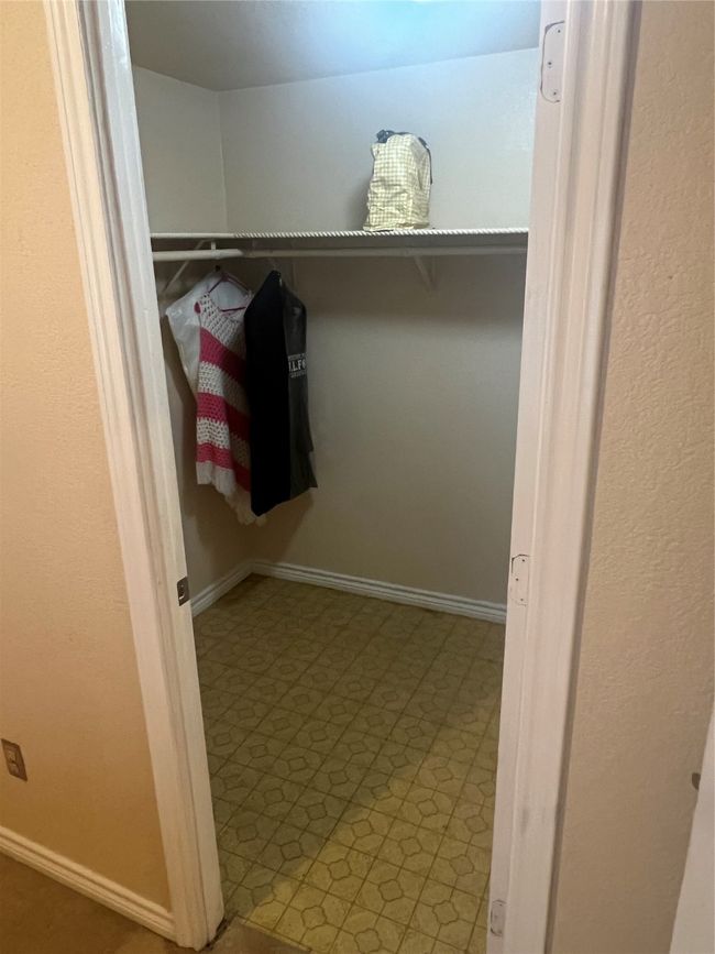 Walk in closet with tile patterned floors | Image 17