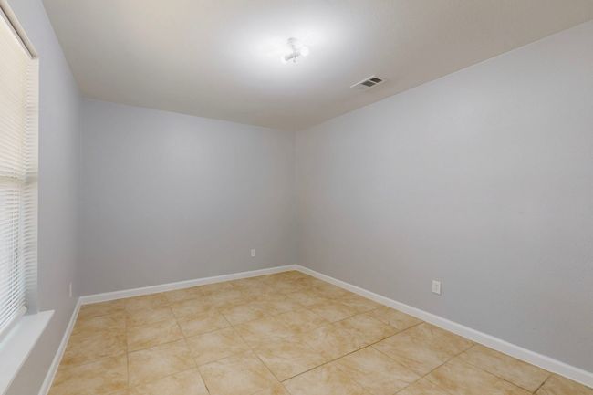 Spare room with visible vents and baseboards | Image 18
