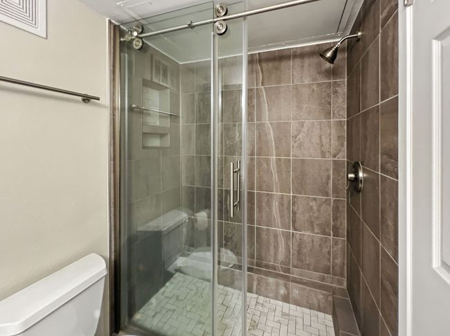 Full bathroom featuring a shower stall | Image 11