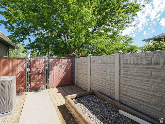 View of patio with central AC unit and a gate | Image 29