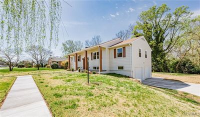 View of front of house featuring a garage and a front lawn | Image 3