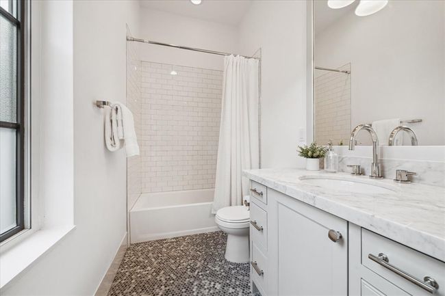 BATHROOM THREE. With vanity area and tub/shower combo. | Image 26