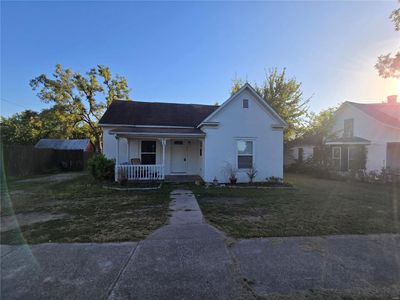 Bungalow-style house featuring a yard and a porch | Image 2