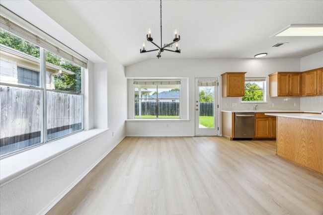 Dining area surrounded by windows and natural light | Image 10