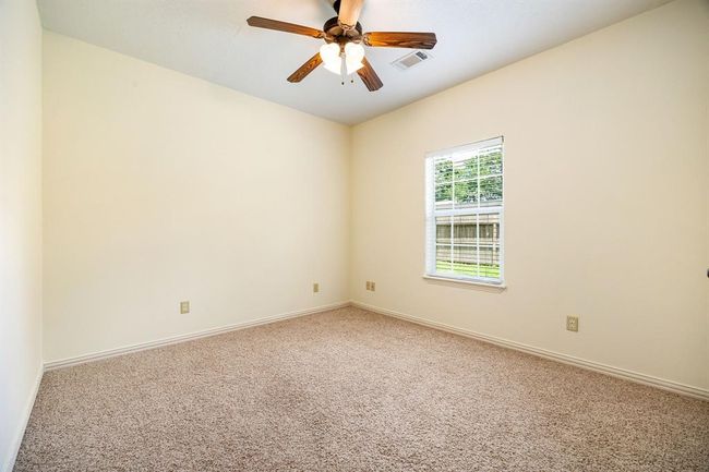 One more view of the secondary bedroom with new carpet and upgraded fixtures | Image 19