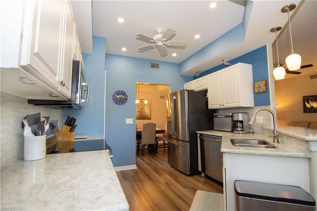 Layout of the well-appointed kitchen is perfect for the home chef! | Image 13