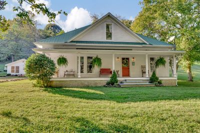 Welcome to 5805 Fly Hollow Rd Santa Fe TN! Beautifully updated 1900's farmhouse on 1.46 acres. | Image 1