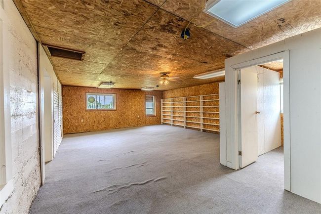 Spare room featuring a ceiling fan and carpet floors | Image 49