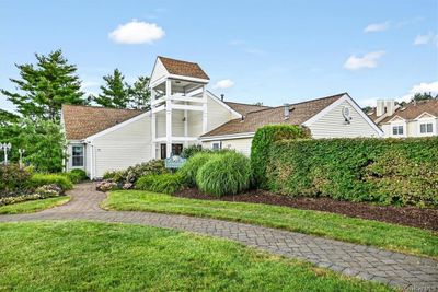 View of property exterior featuring a yard | Image 1