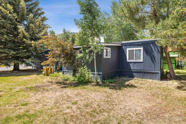 View of home's exterior featuring a lawn | Image 18