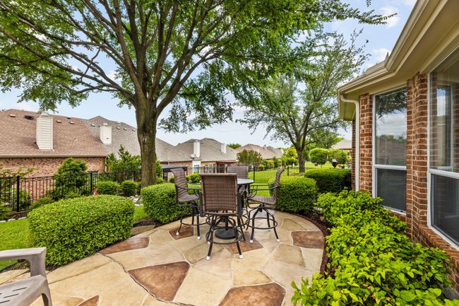 View of patio / terrace featuring outdoor dining area, a fenced backyard, and a residential view | Image 5