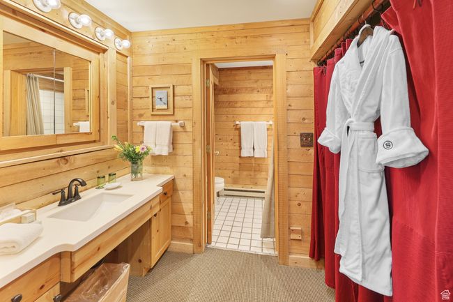 Full bathroom with solid surface countertops and shower/tub | Image 49