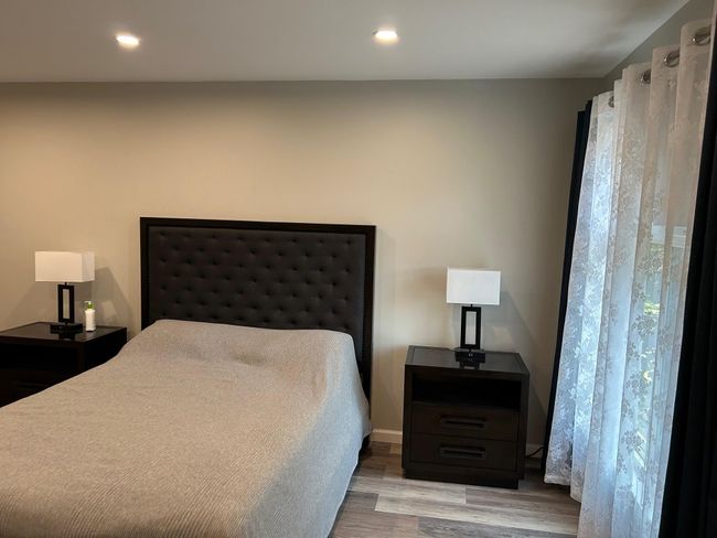 Bedroom featuring wood finished floors and recessed lighting | Image 34