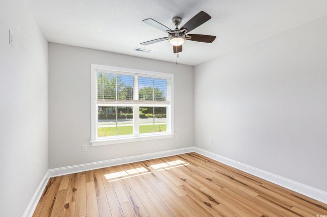 Unfurnished room featuring light wood-style floors and a ceiling fan | Image 24