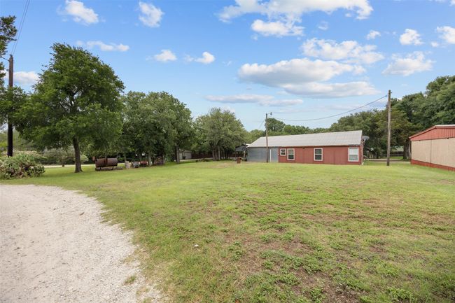 View of green lawn. Large yard minutes from Lake Whitney | Image 23