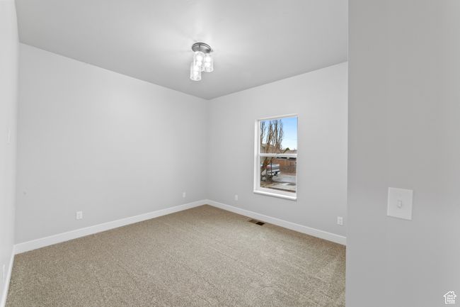 Empty room featuring baseboards, visible vents, and carpet | Image 24