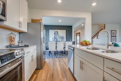 Dining room is large enough to fit a dining room table for 8! Photo is of Welcome Home Center in another community. Finishes may vary. | Image 2